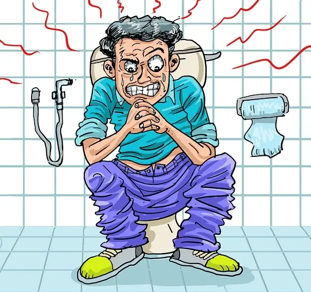 persona costipata stitica seduta sulla toilet - rimedio immediato per andare in bagno